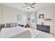 Cozy bedroom with soft carpet, ceiling fan, and stylish decor creating a warm and inviting space for rest at 17330 Harvest Moon Way, Bradenton, FL 34211