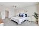 Spacious bedroom with soft carpet and neutral tones, and an ensuite bathroom at 17330 Harvest Moon Way, Bradenton, FL 34211
