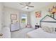 Charming bedroom featuring a whimsical bed frame, a cozy area rug, and a bright window at 17330 Harvest Moon Way, Bradenton, FL 34211
