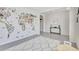 Bonus room featuring a world map and decoratively patterned rug at 17330 Harvest Moon Way, Bradenton, FL 34211