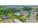 Stunning aerial view of the community pool with lush landscaping and ample parking at 17330 Harvest Moon Way, Bradenton, FL 34211