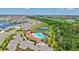 Beautiful community pool with manicured landscaping, ample parking, and recreational facilities at 17330 Harvest Moon Way, Bradenton, FL 34211