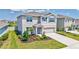 Charming two-story home with a well-manicured lawn and welcoming front garden at 17330 Harvest Moon Way, Bradenton, FL 34211