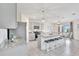 Open kitchen with a large island, granite countertops, stainless appliances, and a dining area at 17330 Harvest Moon Way, Bradenton, FL 34211