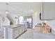 Spacious kitchen featuring gray cabinets, granite countertops, stainless steel appliances and large island at 17330 Harvest Moon Way, Bradenton, FL 34211