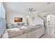 Inviting living room with neutral colors, tile floors, and an entertainment center at 17330 Harvest Moon Way, Bradenton, FL 34211