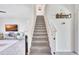 Staircase leading to the second floor with neutral carpet and railing at 17330 Harvest Moon Way, Bradenton, FL 34211