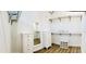Walk-in closet with built-in shelving, drawers, full length mirror, and ample storage space at 17605 Roanwood Ct, Parrish, FL 34219