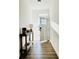 Bright entryway featuring wood-look floors, modern decor, and ample natural light at 17605 Roanwood Ct, Parrish, FL 34219