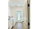 Laundry room featuring updated appliances, cabinet storage, and access to the backyard at 17605 Roanwood Ct, Parrish, FL 34219