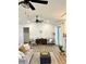 Bright living room with modern furniture, ceiling fan, and stylish decor at 17605 Roanwood Ct, Parrish, FL 34219