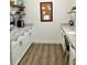 Convenient walk-in pantry with granite countertops and ample storage space at 17605 Roanwood Ct, Parrish, FL 34219