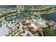 Expansive aerial view of the community clubhouse, pools, tennis courts and surrounding neighborhood at 17725 Northwood Pl., Bradenton, FL 34202
