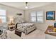 Comfortable bedroom with bright natural light, neutral walls and a ceiling fan at 17725 Northwood Pl., Bradenton, FL 34202