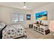Bright bedroom features neutral walls, decorative quilt, white plantation shutters and modern ceiling fan at 17725 Northwood Pl., Bradenton, FL 34202