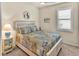Bright, cozy bedroom with decorative bedspread, soft lighting, and a window with shutter blinds at 17725 Northwood Pl., Bradenton, FL 34202