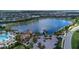 Scenic view of the lake and community, featuring a pool, pier, gazebo, and lush landscaping at 17725 Northwood Pl., Bradenton, FL 34202
