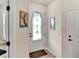 Welcoming foyer with a decorative glass door, neutral walls, and tile flooring leading to other rooms at 17725 Northwood Pl., Bradenton, FL 34202