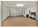 Spacious garage with epoxy flooring, ample storage space, and a work bench at 17725 Northwood Pl., Bradenton, FL 34202