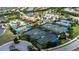 Aerial view showcasing multiple well-maintained tennis courts and recreational facilities within the community at 17725 Northwood Pl., Bradenton, FL 34202