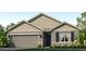 Charming single-Gathering home with stone accents, attached garage, and manicured landscaping at 18303 Wheathouse Pl, Lakewood Ranch, FL 34211
