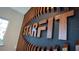 Close up of the Starfit logo displayed on a decorative wood paneled wall at 18303 Wheathouse Pl, Lakewood Ranch, FL 34211