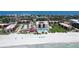 Aerial view of beachfront condos with a pool, and easy access to the beach at 1945 Gulf Of Mexico Dr # M2-313, Longboat Key, FL 34228