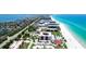 Beautiful beachfront condo building with pristine white sand beach and sparkling turquoise water views at 1945 Gulf Of Mexico Dr # M2-313, Longboat Key, FL 34228