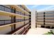 Condo building showcasing private balconies and covered parking at 1945 Gulf Of Mexico Dr # M2-313, Longboat Key, FL 34228
