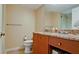 Bathroom featuring a wood vanity with granite countertop and neutral fixtures at 1945 Gulf Of Mexico Dr # M2-313, Longboat Key, FL 34228