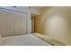 Bedroom with double closet and neutral walls at 1945 Gulf Of Mexico Dr # M2-313, Longboat Key, FL 34228