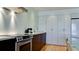 Modern kitchen featuring stainless steel appliances, white countertops, and sleek, minimalist cabinets at 1945 Gulf Of Mexico Dr # M2-313, Longboat Key, FL 34228