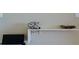 Office nook featuring a sleek retro telephone, artwork and a black chair, offering a stylish workspace at 1945 Gulf Of Mexico Dr # M2-313, Longboat Key, FL 34228