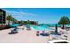Inviting community pool area with beach views, lounge seating, and well-manicured landscaping at 1945 Gulf Of Mexico Dr # M2-313, Longboat Key, FL 34228
