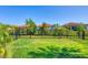 Well maintained backyard is fenced in with lush grass, and nice landscaping at 197 Villoresi Blvd, Nokomis, FL 34275