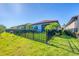 Well maintained backyard with green grass, garden and is fenced in with lush landscaping at 197 Villoresi Blvd, Nokomis, FL 34275