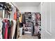 Walk-in closet with ample storage including shelving, hanging rods and shoe racks at 197 Villoresi Blvd, Nokomis, FL 34275