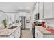 Beautiful kitchen features white cabinets, stainless steel appliances, and granite countertops at 197 Villoresi Blvd, Nokomis, FL 34275