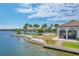 Breathtaking lakefront views with a community pool, sandy beach area, and a private dock, perfect for outdoor enjoyment at 197 Villoresi Blvd, Nokomis, FL 34275
