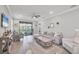 Bright and airy living room featuring neutral decor, recessed lighting, and modern furnishings at 197 Villoresi Blvd, Nokomis, FL 34275