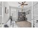 Home office with hardwood floors, a window with shutters, and a couch with decorative bookshelves at 197 Villoresi Blvd, Nokomis, FL 34275