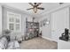 Office with tile floors, ceiling fan, built-in shelving, and large window with lots of natural light at 197 Villoresi Blvd, Nokomis, FL 34275