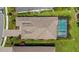 A clear overhead view of the property with a well-manicured lawn and a refreshing swimming pool at 204 Corelli Dr, Nokomis, FL 34275