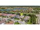 Birds-eye view of the neighborhood with a lake, showcasing the location of a house at 204 Corelli Dr, Nokomis, FL 34275