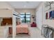 A bedroom features a white bunk bed, a window with natural light, neutral paint, and carpet throughout at 204 Corelli Dr, Nokomis, FL 34275
