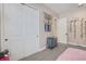 This bedroom features neutral paint and flooring, white closets and doors, plus whimsical ivy decor at 204 Corelli Dr, Nokomis, FL 34275