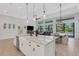 Bright, spacious kitchen with an island, stainless steel appliances, and an adjacent dining area at 204 Corelli Dr, Nokomis, FL 34275