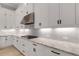 Updated kitchen with sleek appliances, granite counters, and white cabinetry, perfect for cooking at 204 Corelli Dr, Nokomis, FL 34275