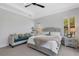 Cozy bedroom with white furniture and comfortable seating area at 204 Corelli Dr, Nokomis, FL 34275