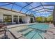 This is a shot of a pool and spa with covered patio space and outdoor furniture at 204 Corelli Dr, Nokomis, FL 34275